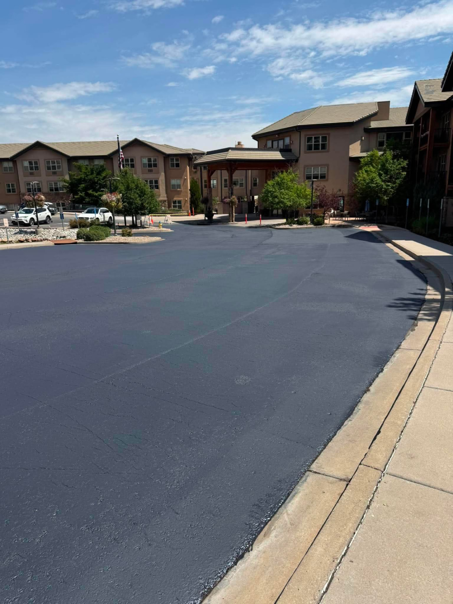Freshly sealcoated parking lot at a Colorado residential community